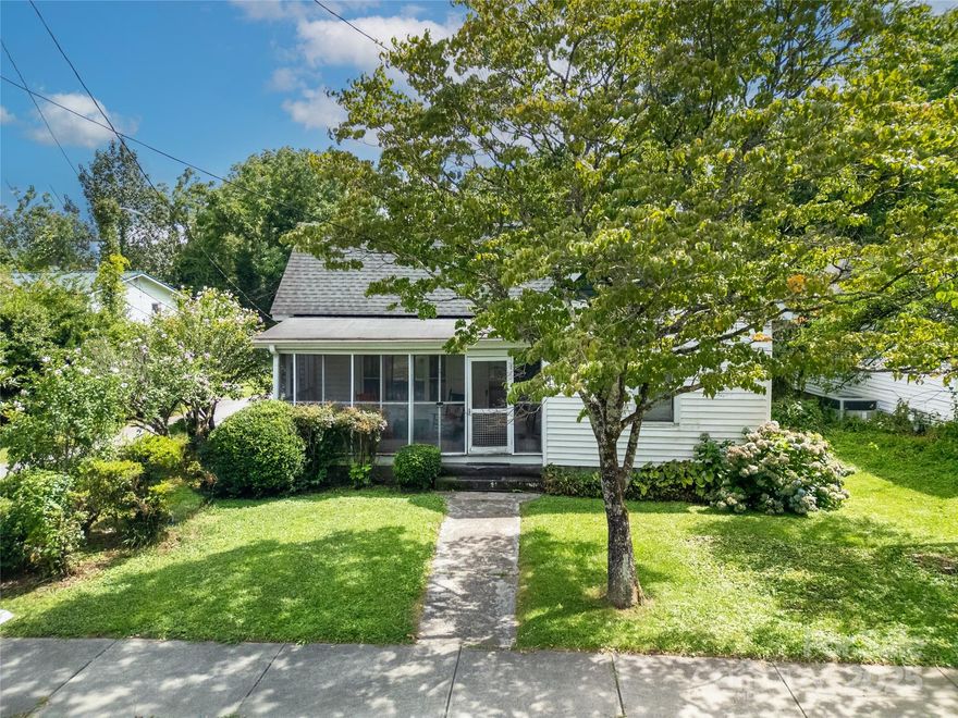 This partially renovated home in Brevard’s vibrant Lumberyard District is full of potential and character. The current owners have begun updates, including plumbing, some electrical work, raised ceilings in the main living area, and a fully gutted kitchen, which reveals the original brick and new insulation. The lot offers off-street parking and rear space for expansion. Located in a Residential Mixed-Use zone, the property may allow up to 3 dwelling units total. It may support short-term rentals (STRs) with the appropriate zoning permit (buyer to confirm with the City). Due to job relocation, the project awaits your vision to bring it to completion. Selling AS IS. With nearby access to galleries, breweries, and trails, this is your chance to create something special, whether a mountain retreat, income-producing units, or an artist’s studio with STR potential.