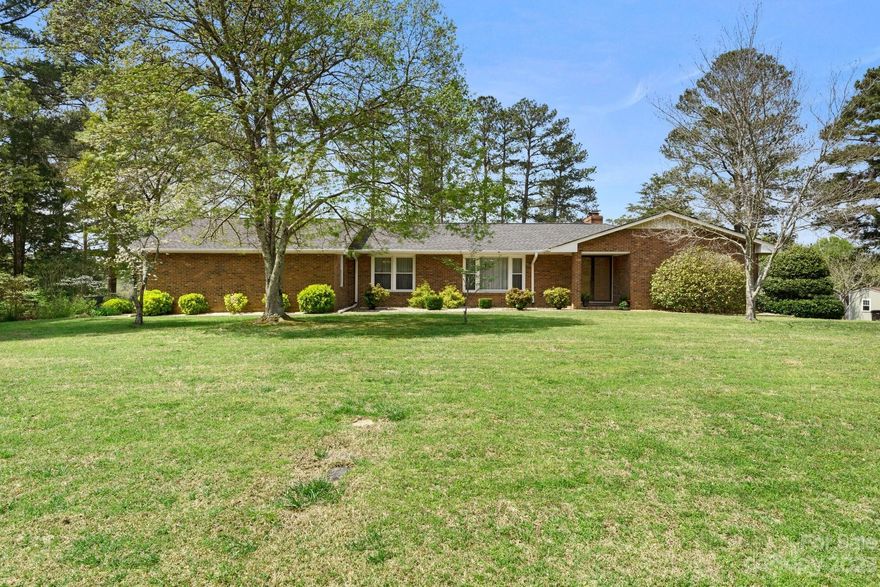 You will be amazed at how immaculate this beautiful, all brick ranch is!  It has obviously received tender, loving care for many years!  It is set on over 3/4 acre that backs to the Rock Hill Country Club golf course.  The yard is landscaped nicely with numerous shrubs and trees, and includes a fenced in garden area.  Double doors welcome you and open to foyer with slate flooring.  Home has formal living room & dining room, a bright, spacious kitchen & breakfast area.  Cozy family room with fireplace & primary suite both open to deck.  Oversized garage includes workshop area.  Recent updates include - Architectural shingle roof 2021, A/C and furnace Nov 2018, garage door (approx 2016), windows (approx 2015).  Seller is offering to include a 1 year HSA Home Warranty.