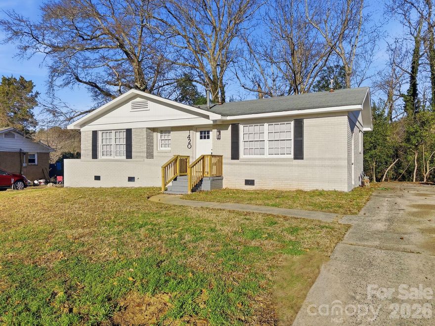 *THIS HOME QUALIFIES FOR 100% FINANCING, $15,000 RATE BUY DOWN, UP TO $5,000 IN CLOSING COSTS & NO PMI!!* 2026 is THE YEAR to make YOUR home ownership goals a reality, and 1420 Rollingwood Dr is THE HOME to make it happen!! This elegant 3 bed 2 bath single-story home in the highly sought-after Clanton Park of Charlotte has been redesigned with you in mind. Fresh interior & exterior paint job w/ new six panel doors throughout, coupled w/ original, refinished hardwoods reinvigorate the home w/ new life. Functional chef's kitchen is ready for all of your culinary endeavors through recent contemporary renovations; highlights include new counters, shaker-style cabinetry, subway tile backsplash, deep sink, tile floor & SS appliances (electric range, dishwasher & microwave). Three spacious bedrooms w/ large, light-flooding windows provide private retreats for any occupants to rest & relax. Primary bedroom provides the utmost convenience for the new owner through ensuite full bath, which includes new vanity, tile flooring & modern floor-to-ceiling tiled walk-in shower. Second full bath is central to remainder of home, and features modern vanity, tiled floor & tile surround shower + tub combo. Tastefully adorned & exceptionally priced, 1420 Rollingwood is one of THE BEST opportunities to hit the Charlotte market this year!!