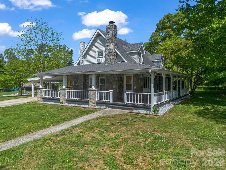 Discover a rare investment opportunity or a multi-generational sanctuary. Situated on a sprawling 1.22-acre level lot, this unique property features a stunning, custom-built granite farmhouse that serves as the centerpiece of the estate along with a sizeable updated duplex currently income producing. Built in 1947, the main residence exudes character and craftsmanship, offering a spacious 3-bedroom, 3-bathroom layout with over 2,300 sq. ft. of living space, featuring an open floorplan, a split-bedroom plan for privacy, and beautiful stone and wood finishes and timeless accents of character.  Additional flex spaces provide even more potential for expanded living and income opportunities.

Complementing the main house, the versatile duplex provides two additional income-producing units:

Unit 102: A comfortable 1-bedroom, 1-bathroom space (approx. 880 sq. ft.).

Unit 104: A cozy 1-bedroom, 1-bathroom unit (approx. 476 sq. ft.).

The exterior is designed for relaxation, boasting a fire pit for cool Carolina evenings, a covered carport, and ample parking. With city water, established septic, and multiple heating/cooling systems (including ductless mini-splits), the property is well-equipped for modern comfort.

Whether you are looking to live in the granite main house while offsetting your mortgage with rental income, or seeking a turnkey multi-unit portfolio in a prime location, this property offers endless possibilities.