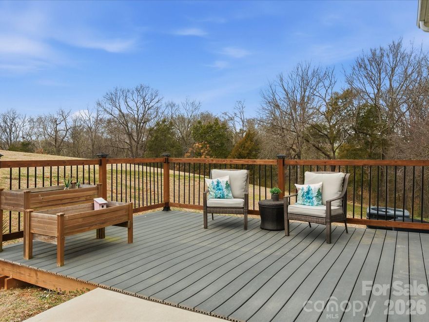 This home has 3 Bedrooms 2 bathrooms(home has a 2 Bedroom Septic System permit per Union County 4 occupants) Practically brand new home, with over 1.5 acres, no HOA.  The covered front porch greets you, a sweet spot for coffee!  The front door with window, privacy surrounds you, with wooded views, tucked off the main road. Main living area is a huge great room, an open concept living space with a large kitchen and living area, flooded in light from the sliding glass doors.  Plenty of cabinet space, room to add an island, or a large dining room.  Main level primary suite with large walk in closet, another walk in utility area also used as additional storage/closet, with a full bathroom attached with a linen closet.  Upstairs you will find 2 more large bedrooms/ office / den with walk in closets, ceiling fans, and wonderful views of the surrounding countryside.  Outdoor entertaining is easy with large patio right off the living area and an added deck area.  2 car parking spaces, lovely landscaping, perfect peaceful setting surrounded by nature.  There is a shared well agreement (FHA/Lender Compliant) and driveway easement for the 4 homes in this community.  Main level laundry with additional storage, just off main living area!  Entire home has Vinyl plank flooring for easy living, stairs are hardwood as well! Welcome Home!