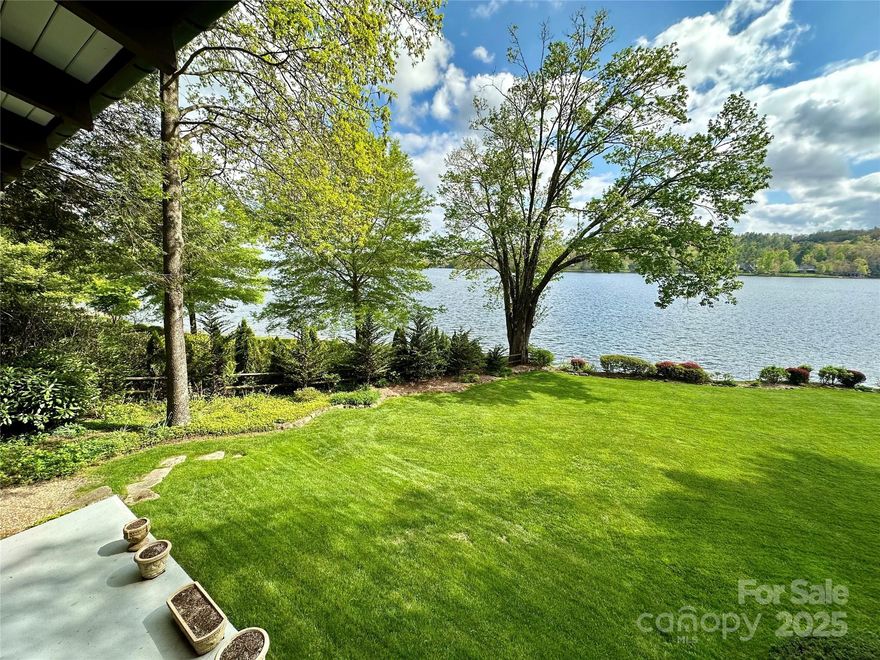 Absolutely one of Lake Toxaway's finest lakefront settings, this celebrated home is on a large, flat, private lakefront site on Chimney Point with a stunning view of fabled Lake Toxaway and Toxaway Mountain.  This 3 BR, 
3 BA home features two bedrooms and bathrooms on the main floor, vaulted ceilings, large stone fireplace, granite countertops, large covered porch with outstanding view, boathouse, large boat dock, and expansive flat back yard with deep water access. This park-like setting features beautiful trees, azaleas, a circular driveway, a two-car garage, a hot tub overlooking Lake Toxaway, and one of the most remarkable settings on the entire lake.
