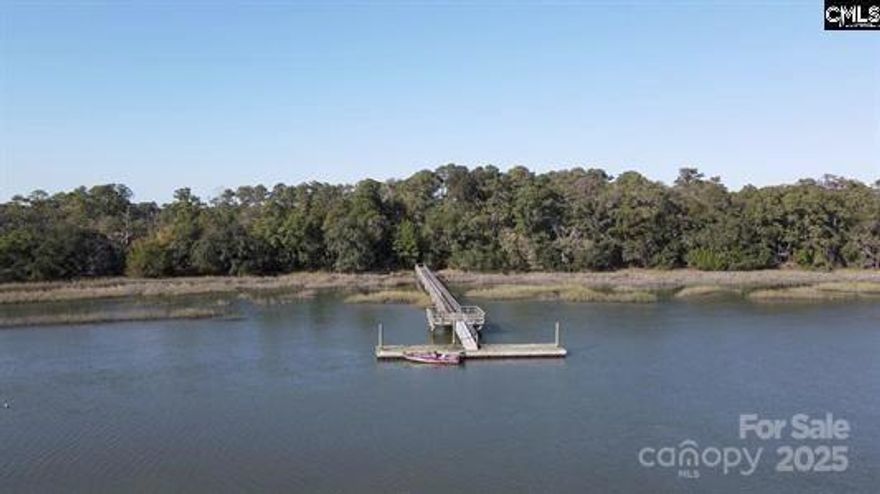 Discover Grangers Retreat Island, an exclusive collection of waterfront lots for sale on a coastal island in Beaufort, South Carolina. (Other available lots include 1, 4, 6, 7, and 9—see plat and pictures for more information.) Accessed by your own private 0.5-acre mainland lot, complete with a large pier and floating dock. This mainland lot property is just steps away from the Wallace Boat Landing. A short boat ride transports you to the island, where you can enjoy a private paradise surrounded by graceful windmill palms, majestic palmetto palms, and classic magnolia trees.The island offers modern amenities, including underground electric and well water, making it an ideal spot for your dream getaway or permanent residence. The private shared pier and floating dock provide easy access to Capers Creek, just moments from the vast open waters. Plus, it’s conveniently located just a quick commute to Highway 21, the charming downtown Beaufort, and the upgraded Beaufort Executive Airport.