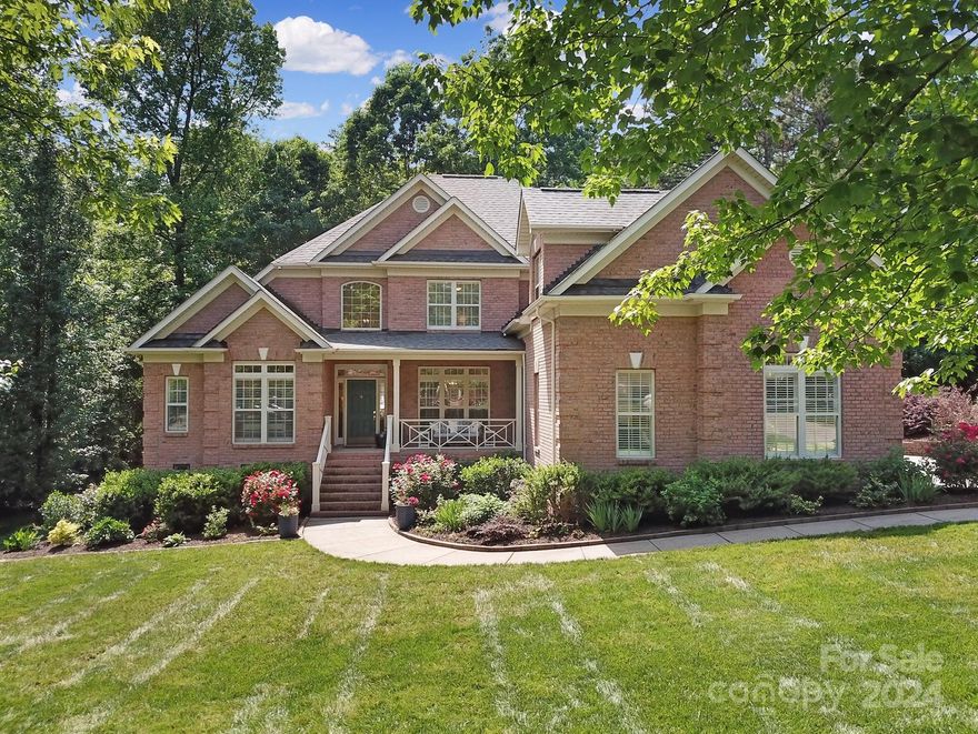 Welcome home to this gorgeous custom-built residence in desirable Hidden Forest! Enjoy serene mornings in this private property nestled among the trees along a spring fed creek on a 0.65 acre lot with expansive back deck. The exterior is full-brick and beautifully landscaped with a new roof in 2023. The front porch is surrounded by a newly built custom railing. Inside you’ll find a freshly updated kitchen with Dolomite marble backsplash; new and refinished hardwoods throughout the main floor; designer light fixtures in living areas; marble countertops in secondary bathrooms; and Schumacher wallpaper in the hall bath. As a bonus, the crawl space has been updated into a fantastic flex space with French drain/dehumidifier, ideal for a home gym or games. Oversized garage and several walk-in attics provide extra storage. Attention to design and detail is apparent throughout. Sellers are having to relocate for work reasons and are asking for less than they paid including their updates.