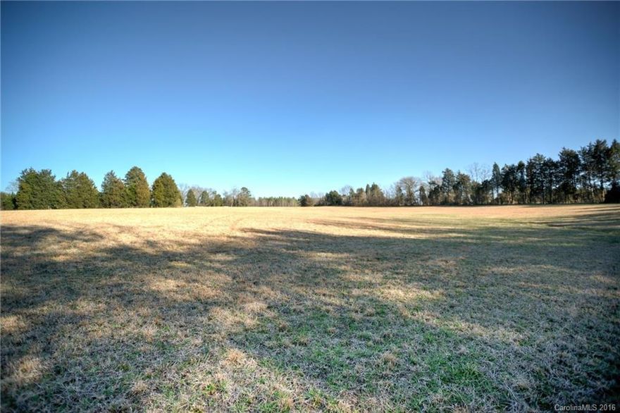 Versatile 18 acre private property with beautiful wooded areas, creek and pasture.