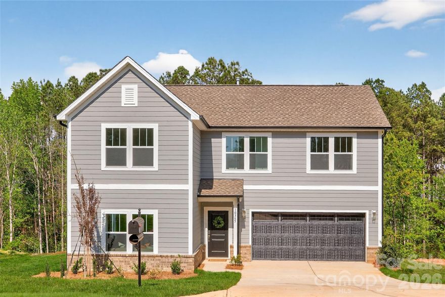 Quick Move-In Opportunity! 3BR / 2.5 BA Charlotte floorplan features an open concept main floor with well-appointed kitchen featuring upgraded tile backsplash, quartz counters, cabinetry, and SS appliances! Second level boasts spacious secondary bedrooms, additional full bath, laundry, and large Primary bedroom with tray ceiling and ensuite with  walk-in shower. Amenity Filled Edgewater Golf Course Community features Community Pool, Biking and Walking Trails, Boat Docks, Clubhouse, and Active Community Calendar!