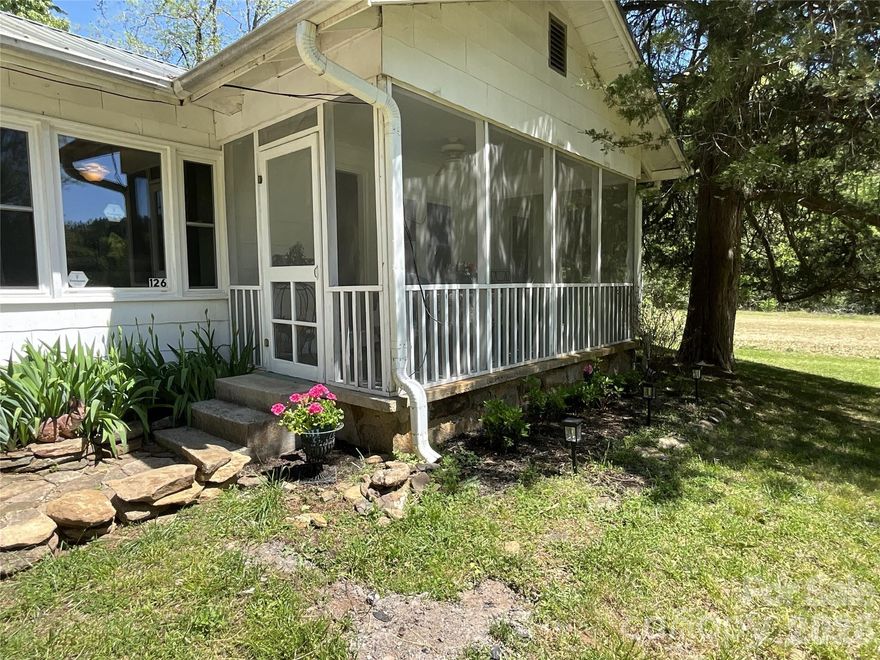 Quiet setting at the end of the street on 35 acres with a cute 2-bedroom, 1 bath farmhouse. Multiple streams and cleared level building sites and garden areas on the property. There are plenty of options for potential investors. The seller had plans to put in a RV park with a separate section for small cottages & cabins. The existing home would be perfect as an office/caretaker's quarters, while there are multiple options for building a personal home on one of the other large cleared private sections of the land. This property also would make a great equestrian estate. Located just behind the Apple Valley subdivision of Rumbling Bald community, it's close to golf, restaurants, grocery store, town of Lake Lure, Forest City/Rutherfordton and the Tryon Equestrian Center. No storm damage or flooding from Helene. There were some downed trees, which did not impact the home or other structures. By appointment only.