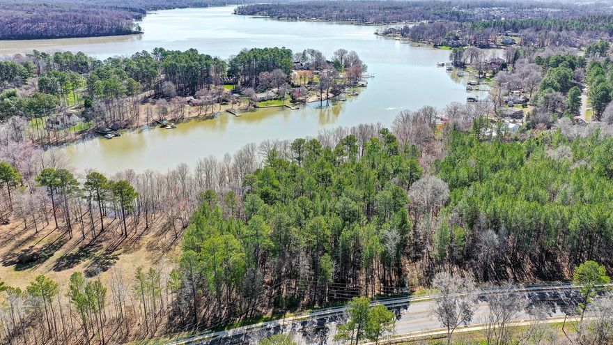 Build your waterfront  dream on Lake Wylie! This level lot is over 2 acres and located on a serene cove just off the main channel.  Featuring mature trees, perfect for shade and privacy, 490+/- feet of natural shoreline, and stunning lake views. You will feel like you are on vacation every day!     While this lot is not able to obtain a dock permit you can launch a canoe or kayak from your backyard.  With this much acreage its easy to relax and enjoying the abundant wildlife and impressive lake views. Excellent Clover schools, SC taxes, convenient to restaurants, and shopping.