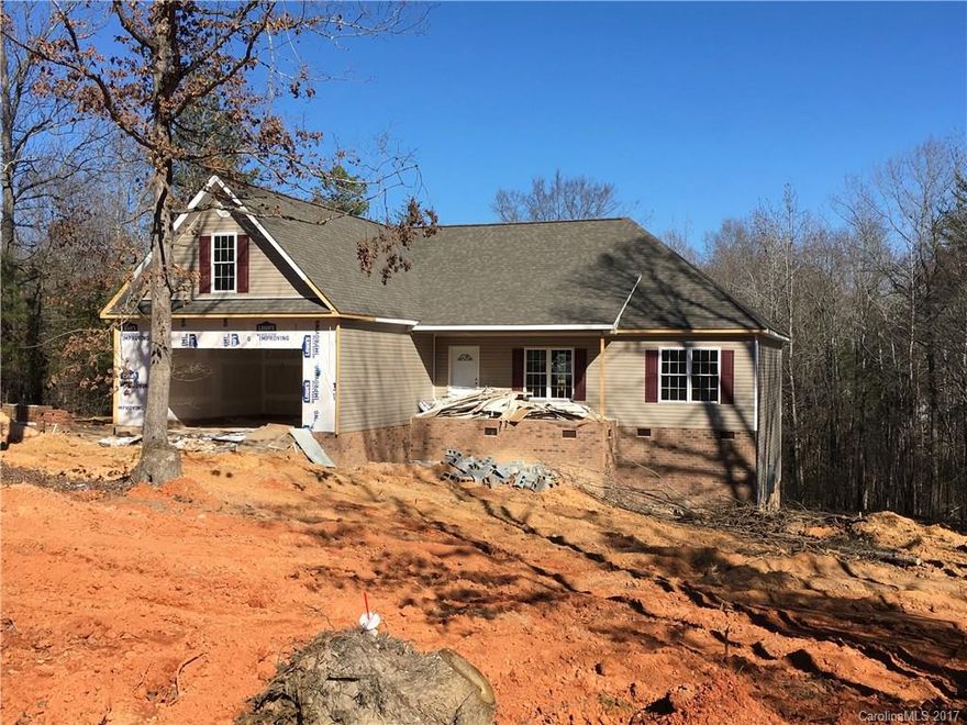 No HOA-Clover Schools New! country setting-Clover Schools. Split floor plan, Beautiful Custom Cabinets, Front porch, great back deck has wonderful back view-makes you feel like you are in the mountains. Master BR w trey ceiling, Master bath w/vaulted ceiling, dual vanities sep shower, whirlpool tub. Great room w gas log fireplace, FML  Dining room, EIK area, Large bonus room, full door in back foundation has room for storage.  Less then 30 days to completion can be done by April 15