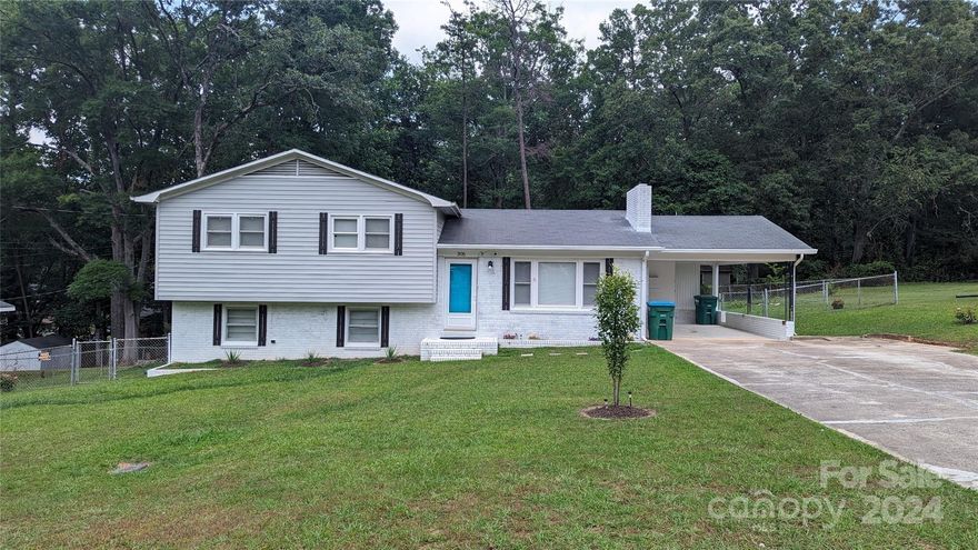 BEAUTIFUL Brick split level with finished Basement!! LOTS of Potential! Spacious split level home with lots to offer! Great cabinet and counter space in kitchen. Hardwood floors in living room, stairs and upstairs bedrooms.  The basement has a 4th bedroom and large den area with laundry room and kitchen! Downstairs would make a great master suite and private den area or rental. Amazing fenced back yard with HUGE wired workshop. Must See!!