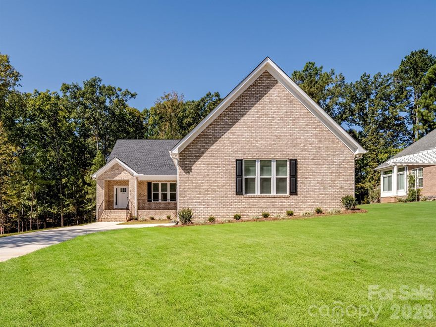 Welcome to this Beautiful/New Construction Home ln the All-Full Brick Community of College Place!  This Perfect Open Floorplan offers 4 BR, 3.5-BA w/All bedrooms on the Main Level, plus a Private Office and Formal Dining Room!  Complete with a butler’s pantry, wet bar, & abundant soft-close cabinets for storage. The gourmet kitchen features white soft-close cabinetry, a large island & quartz countertops, glossy subway tile backsplash, pendant lighting & SS appliances including a gas range/oven.  The spacious family room is ideal for entertaining, highlighted by a Touchstone Smart Fireplace & French doors that lead to an enormous covered back porch with peaceful views of the surrounding trees. The Gorgeous Primary Suite includes private access to the back porch, dual quartz vanities, a large walk-in tiled shower, an expansive walk-in closet & a private entrance to the laundry room for added convenience. Additional features of this exceptional home include wide luxury plank flooring in all common areas, fully framed windows with 2" blinds throughout, Mud room w/granite seat & cubbies, ceiling fans in every bedroom & a large, French drains at all corners of the home, deep garage designed to accommodate full-size trucks & toys! The crawlspace is a tall space with plenty of room for extra storage and or even a workshop!  With its blend of comfort, elegance & function, this beautiful, newly constructed home offers everything you could ask for in this quiet, established neighborhood.