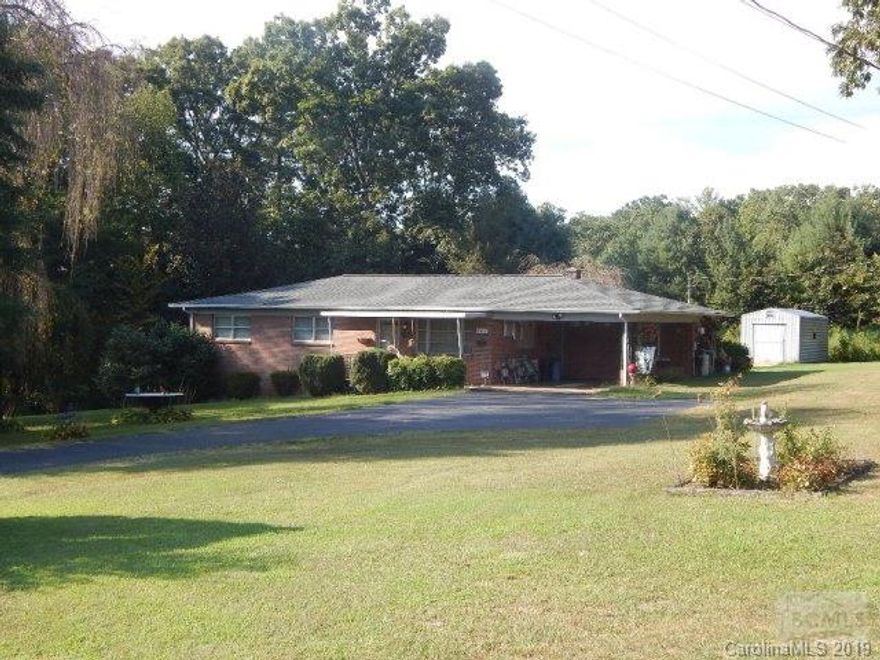 Possibilities with this adorable 3BR /1 BA Brick Ranch home on 3.42 acres located on a quiet cul-de-sac minutes to shopping and I-40 access. Just the right size as is or plenty of room to add on for an expanding family. Attached carport and outbuilding, but has lots of level land to build a detached workshop or garage for whatever your needs and hobbies are. Paid City water tap at the road. Easy to show.