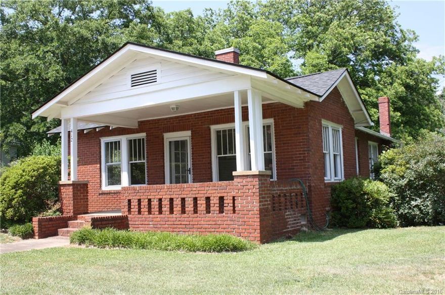 In town convenience with old world charm. This 1920's brick home has been renovated but still has the vintage appeal of an older home. Features: refinished wood floors, high ceilings, wide plank and beaded board ceilings, country kitchen, spacious living room and dining room, updated bath, covered front & enclosed back porch, sun room/utility, double detached garage with attached chicken coop and outbuilding. Walk to town location on a very attractive 1.17 acres lot.