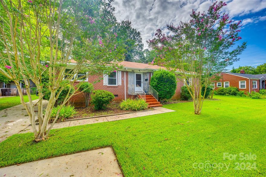 This charming 4 bedroom brick ranch in the heart of Rock Hill is looking for its new owners. As you walk in, you'll find the living room with gas log fireplace and opens to a dining area and wood floors throughout most areas of the home. Off the dining room is a bonus bedroom with its own half bath. The kitchen was updated in 2020 with new flooring, countertops, & cabinets. There is a bedroom off the kitchen that could also be used as a flex room. Down the hallway is an updated full bathroom with new tile flooring, shower & new vanity. At the end of the hallway is another bedroom and the primary bedroom with 2 closets. There is a mud/laundry room off the kitchen with a utility sink, new counters & back door leading to a deck and fully fenced backyard. HVAC & Water Heater were installed in 2020. Professional photos coming soon. CALLING FOR HIGHEST AND BEST BY MONDAY 8/12/24 AT NOON.