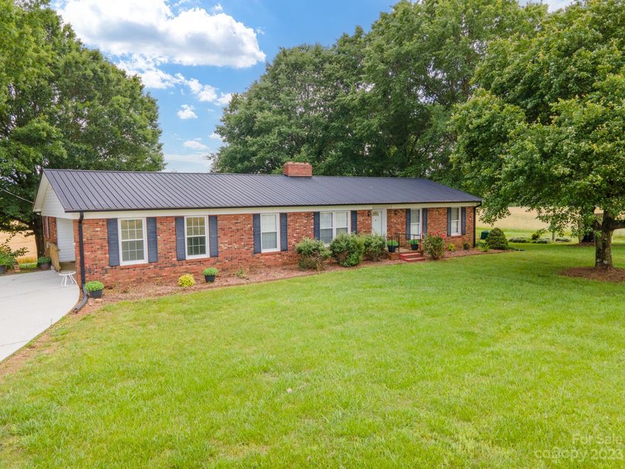 Please submit best offers by 9am on Tues. June 13th. One Family Brick Home, Full Basement, Large Patio Area, Detached Garage Workshop, Pole Barn & 1.9 acres of unrestricted country acreage that was once part of a Large Family Farm. Huge Concrete Deck overlooking a peaceful shaded backyard & fields that are still in use today. Driveways on each side of the home, one is concrete & leads to a carport & a short ramp for easy access; the other to the ground floor level one-car garage & partially finished basement. Inside features large rooms, an island kitchen, granite countertops, custom cabinetry, 2 fireplaces, replacement windows & some doors with inset blinds. Great location in the Cool Springs area not far from I-40 & I-77 w/ easy drives to Charlotte, Winston, Boone, Hickory & Lake Norman. The home will be open Sat morning for the last day of a personal property Estate Sale. If you want to see all areas of the home, you must have a scheduled appt. Septic, floorplan, maps on file.