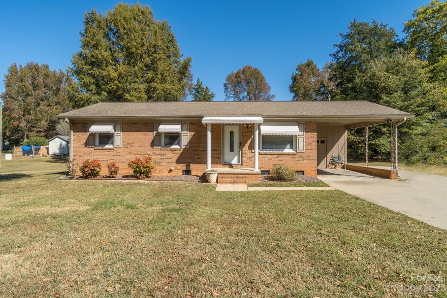 Excellent opportunity to own a 3 bedroom home in Kings Mountain on over a half acre with no HOA. This traditional brick home has original hardwoods in all bedrooms and living room. The HVAC was replaced in 2023. There is also a fabulous sunroom off of the dining area that leads out to the spacious backyard. The outbuilding at the back of the lot has plenty of room for your storage needs. There is also a large concrete pad to the right of the outbuilding that would be a perfect spot for a firepit and grill. This home is conveniently located less than 15 miles from the Gastonia Honey Hunters Baseball Stadium and Fuse District and only 11 miles from Crowders Mountain State Park and 11 miles from Kings Mountain State Park. Schedule your showing today!