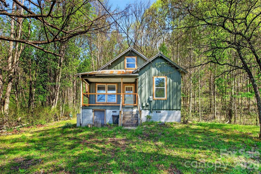 488 Cad Campbell Road is set on 20.8 unrestricted acres.  This property offers a rare mix of natural beauty and usability—featuring open meadows, pasture areas, and untouched woods, all tucked into a scenic mountain valley with only one neighboring property in sight. Accessed by a well-maintained gravel road, the setting feels private and peaceful, yet far from isolated.

For those seeking a more self-sufficient lifestyle, this property delivers. With mountain spring water servicing the home—and even a gravity-fed spigot in the event of a power outage—off-grid capability could become a reality with a few more adjustments.

 The fully renovated kitchen features new cabinetry, appliances, and lighting.  A separate laundry room includes a new washer and dryer. The home is heated with a wood stove and propane wall heater. There are two mini splits on site that just need to be installed. Additional updates include double-pane windows and new flooring throughout.

The main level offers two bedrooms and a refinished bathroom.Upstairs, a flexible third space provides the perfect opportunity for an additional living area, office, or studio—framed by windows that capture both front and back views of the property.

The property also features excellent foraging, abundant wildlife, a small cellar for storage, a cinderblock outbuilding, and a large barn with previous electric and water access—ready to be brought back to life with a little vision. A beautiful stream divides the property from the neighboring owner that you have access to as well!

All of this, just under 4 minutes to Dollar General, approximately 30 minutes to Burnsville or Spruce Pine, and 35 minutes to Johnson City—offering the perfect balance of privacy and convenience. Offered as-is, this property is move-in ready for comfortable living today, while still leaving room for you to make it entirely your own. No Drivebys! Showings by appointment only!