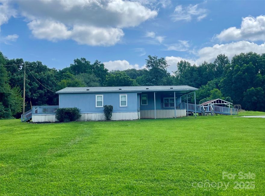Farm life ready! Large 3 bedrooms 2 full baths triple-wide situated on over 1.90 acres of unrestricted land and only minutes from downtown York. (No city taxes!) Get your creative side ready to make this home your own!  Several accessory buildings on the property will remain as well. $500 closing costs credit for qualified buyers through our preferred lender.