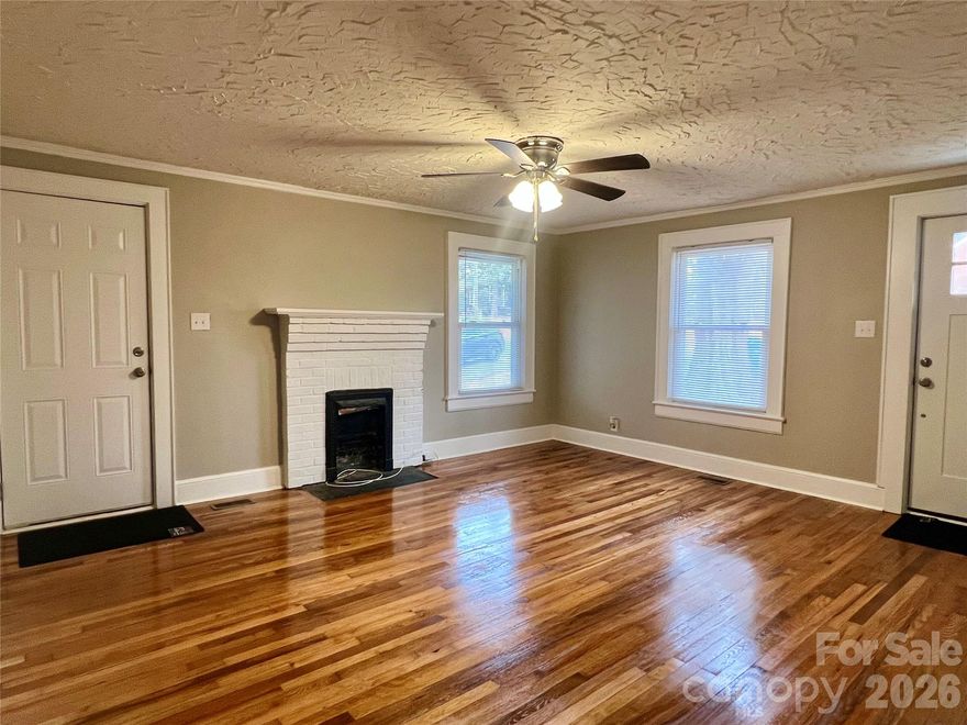 Price Improvement! This home offers excellent curb appeal and is truly move-in ready. Conveniently located near Hwy 70, Hwy 321, and downtown Hickory, it provides easy access to shopping, dining, and commuting routes. The major systems have already been updated, including a roof, HVAC system, and water heater that are all just one year old.
Beautiful hardwood floors have been freshly refinished and are complemented by new paint throughout the home. The kitchen and bathroom have been thoughtfully renovated and are ready for the next owner to enjoy.
The spacious covered front porch will be a great spot to relax as the weather warms up. Additional improvements aimed at minimizing future maintenance include new insulation, a new vapor barrier, and new foundation drains.