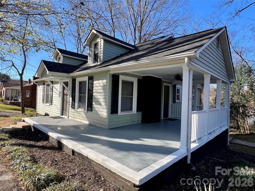 Price Reduction! This home boasts great curb appeal, and is completely move in ready! It's also in an incredibly convenient location near Hwy 70, Hwy 321, and downtown Hickory. This home has all of the big-ticket items already covered- it features a new roof, HVAC system, and water heater that are all just a year old! Beautiful hardwood floors have just been freshly refinished, complemented by fresh paint throughout. The kitchen and bathroom have both been tastefully renovated, and ready for the new owner.
The large, covered front porch will be the perfect place to be when the weather warms up. This home also offers important improvements designed to reduce future maintenance, including new insulation, a new vapor barrier, and new foundation drains.