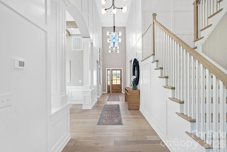Prepare To Be Impressed!!! Step into pure luxury, a former Model Home where designer flair meets everyday comfort in desirable Camellia Gardens in highly sought after Harrisburg, NC. This 5 bedroom, 4 full bathrooms along with a media room is sitting on a level, oversized 0.3 Acres Lot.
As you enter, be captivated by the dramatic two-story foyer with three elegant chandeliers that create a grand, welcoming first impression. Just beyond, the formal dining room showcases a sophisticated coffered ceiling, setting the perfect tone for memorable gatherings & refined entertaining along with in-built speakers throughout the house.
This 3600 sq ft masterpiece is dripping with high-end upgrades, from its chef-inspired quartz kitchen to the gleaming hardwoods that lead you through a sun-drenched, open concept layout. Selective upgrade list can be found in the attachments.
Main level boasts an expansive spa-like primary suite along with a flexible main level bedroom with full bath provides convenience for guests, multi-generational living or a private home office. Main level laundry, large mud room, spacious living room with built-ins and fireplace are additional things to boast.
The Second Floor impresses with its own array of versatile spaces: a bright loft with built-in desks ideal for homework, remote work or creative projects, a dedicated media room perfect for movie nights or game days plus  3 large additional bedrooms & 2 full baths.
Outside, enjoy the oversized backyard under a covered porch - perfect for outdoor dining, play, a cozy fire-pit and future landscaping dreams (like a pool along with outdoor kitchen!!). This beautifully landscaped lawn has in-ground sprinkler system, accent focus lights highlighting the home's architecture - enhancing nighttime curb appeal.  The neighborhood has excellent community amenities like outdoor pool, playground, walking trails, sidewalks etc. Just steps away from Stallings Road Park, offering even more green space & recreation.
PRIME LOCATION : Located in the thriving town of Harrisburg, you're minutes from top-rated schools (including Harrisburg elementary, Hickory Ridge middle & High), shopping, dining, grocery stores and major highways for easy  commute to Charlotte, Concord & beyond. This is suburban living at its best - quiet, peaceful & convenient.
With modern construction, breath-taking upgrades, this home is truly move-in ready. Whether you're looking for room to grow, dedicated spaces for work & play or a sophisticated home to entertain, this home checks every box! Most of the beautiful furniture & decor are available to purchase at a highly reduced cost! Just come and unpack your suitcases, it is truly move-in ready.