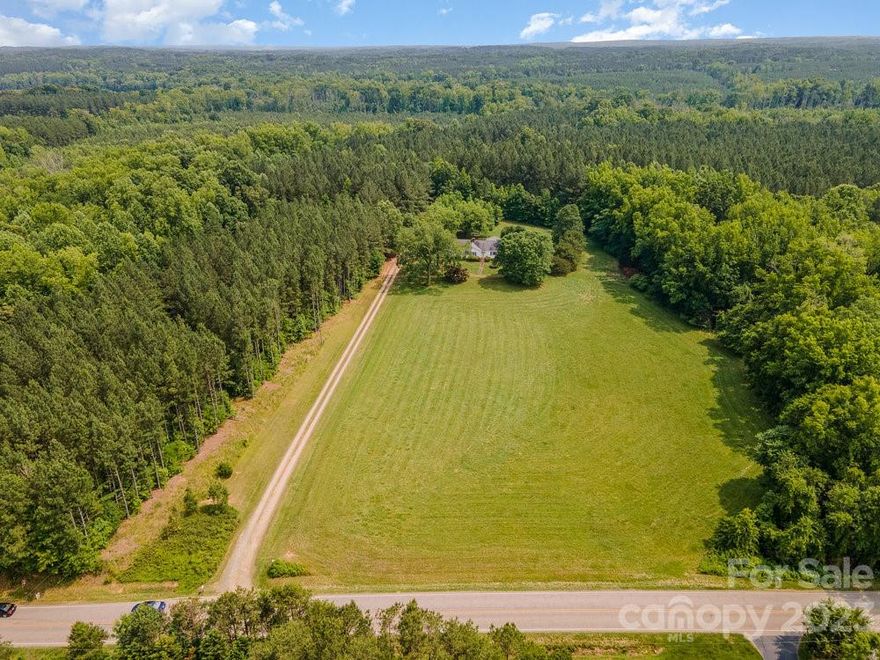 3BR, 2BA home located on over 5 acres for less than $400,000!  This rural location offers the privacy and quietness of the country yet 15 minutes to I-85. The home has beautiful hardwood flooring, kitchen cabinetry hand built by the owner from hackberry trees from  the property, a basement with 1741 square feet that is completely floored and perfect for storage, a shed and more!  With a large living room and a family room, this home allows for families to grow and play.  NO HOA, NO city taxes and located in the Mount Pleasant School district, this home is a gem!    A fuel tank is located on the property and according to the seller was pumped when heat pump was installed in 2018. Oven does not work but the cooktop does work.  Home to be sold as-is.  MULTIPLE OFFERS HAVE BEEN RECEIVED.  PLEASE SUBMIT ALL OFFERS BY SUNDAY, JUNE 11TH AT 12PM.