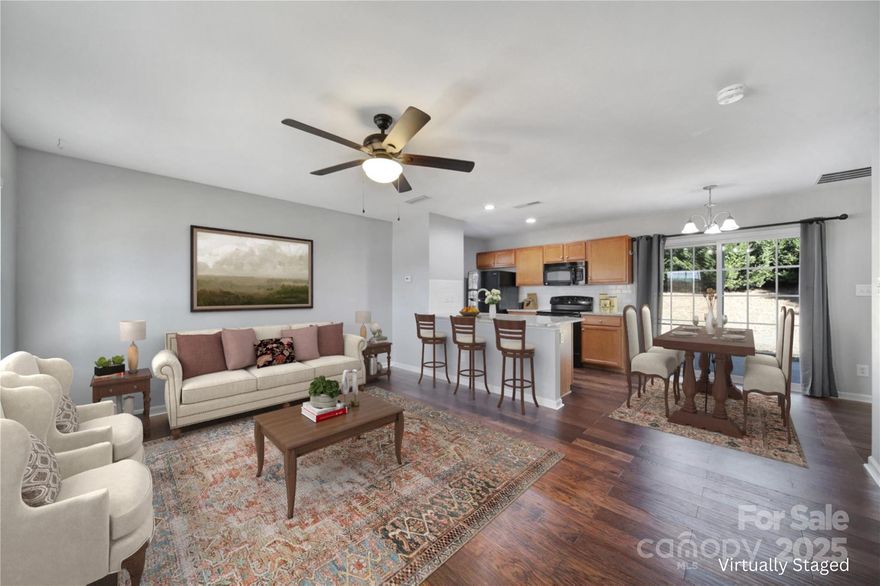 If you're looking for affordable housing, this is it! This charming 3-bedroom, 2-bathroom home is the perfect package in the award winning Clover school district. The main level features laminate wood flooring, a cozy living room, dining area and an open kitchen with plenty of cabinet space, a full pantry, and sliding doors that open to the back patio. Upstairs, the primary bedroom stands out with vaulted ceilings, an en-suite with a garden tub, and a wide vanity. Two additional bedrooms and a full hall bath round out the second floor. Step outside to a fenced-in backyard perfect for pets, play, or weekend cook-outs. You’ll also enjoy a one-car garage, a shed for your yard tools and toys, a corner lot and the peace of mind that comes with a move-in-ready home. Take advantage of this great location close to schools, shopping, and downtown Clover. This property is eligible for 100% USDA financing, so let's see if you qualify!