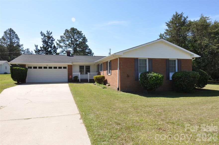 Three-bedroom, two-bath all-brick ranch situated on a spacious double lot totaling approximately 0.78 acres. This well-maintained home features a two-car attached garage with an automatic door opener and a cozy fireplace in the den. The galley-style kitchen is appointed with classic wood cabinetry and offers efficient functionality.

A generous formal living room provides flexible space for both living and dining arrangements. The home includes large bedrooms throughout, ensuring comfort and versatility. A standout feature is the heated and cooled sunroom, filled with abundant windows that invite natural light year-round.

With ample indoor living space and expansive outdoor potential, this property offers both comfort and opportunity. Ideally located just minutes from downtown Chester, you’ll enjoy the benefit of county taxes while being part of a growing community. Convenient access to Charlotte and Columbia makes commuting or travel easy.