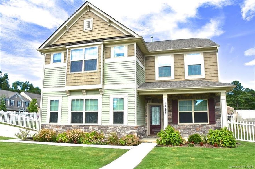 Gorgeous craftsman style 2 story home w/custom upgrades.Stone front accent, lovely front porch, white picket fence & lrge corner lot. Detailed entry w/double crown moldings & picture framed walls. French doors lead to private office. Main level has wide plank hrdwd flrs & gourmet kit. w/granite counter/tile back/custom cabinets w/trim pkge,5-burner gas top, wired island, pendant lighting & under cabinet lighting w/huge walk in pantry.Open GR w/frpl. Lrge Mbedrm w/trey ceiling & walk in closet.