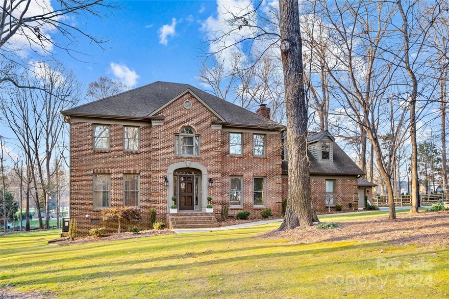 Nestled in the heart of Weddington, this cherished home is situated on over 1 acre and boasts a picturesque setting that is embraced by a lush canopy of beautiful, mature trees.  This two story, full brick home welcomes you with a graceful entryway and into its generously sized living spaces. The interior is adorned with floor-to-ceiling windows that flood the rooms with natural light; hardwood floors, fire place and a lovely kitchen. Complete with an eating area by a beautiful bay window, the kitchen is outfitted with granite countertops, stainless steel appliances, gas range and truly serves as the heart of the home.  Upstairs, all bedrooms and bonus room offer ample space, plush new carpeting and a back staircase.  Step outside to an extra large, partially screened-in deck overlooking the expansive and flat backyard and enjoy this haven of space and tranquility. This home comes with a two car garage and a separate fully insulated brick storage building.