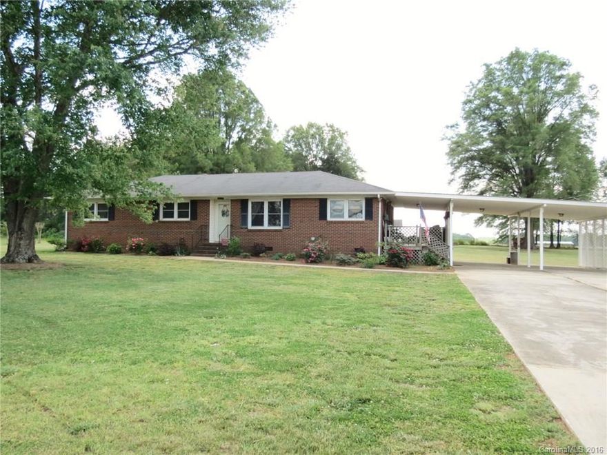 Beautiful updated home on a large lot w/ spectacular hardwood trees and awesome out-buildings. The interior of the home has hardwood floors through-out, updated kitchen w/ granite, stainless steel appliances, breakfast bar and eat-in dining area. Dining room/Family room combo has large windows to let in plenty of natural light. Master BR with bath. The exterior features 2 large storage buildings w/electric and cement floors- Ideal for workshop and storage. 2-car attached carport & covered patio.