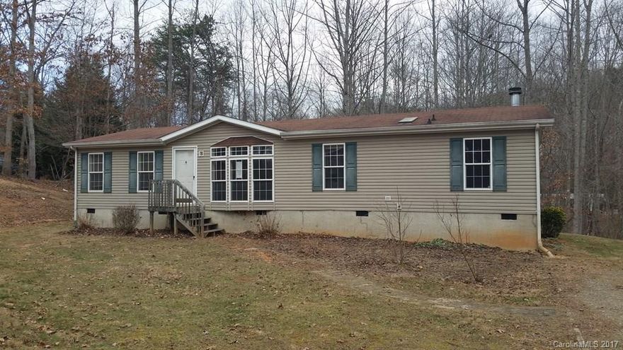 3 bed/2 bath modular approximately 15 minutes from downtown Asheville. Open, split-bedroom floorplan features kitchen w/ dining area, living room, den w/ fireplace, laundry, and master suite. Case# 381-927955. Uninsured, Subject to Appraisal. Seller/listing agent makes no representations or warranties as to property condition. Sold As-Is. Equal Housing Opportunity. Seller may contribute up to 3% for buyer closing costs upon buyer request.