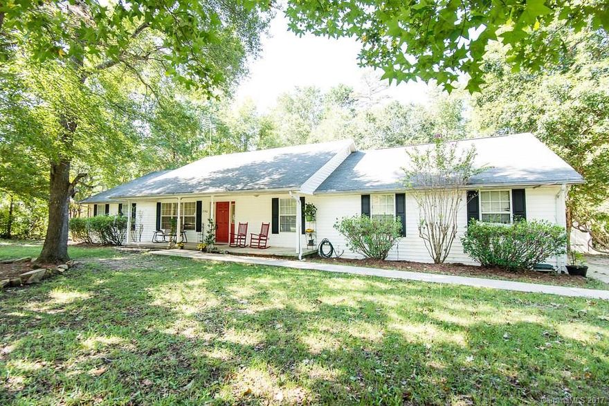 Spacious home in  quiet rural neighborhood, minutes from I-77 and on 3.95 acres! This 3 bedroom/ 2.5 bath (plus an office) home boasts an open floor plan, granite counter tops, laminate wood floors, large family room, large sun room, fenced back yard, two car garage, in ground sprinkler system, and a creek on property! Home also has an in ground pool with a separate 600 foot pool house/ mother in law suite that has its own well and septic, central heat/ air and is handicap accessible!