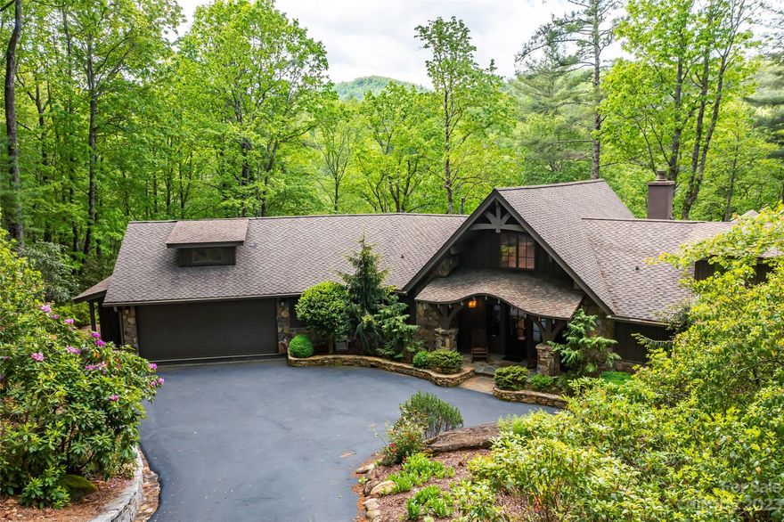 Unique in almost every way, this elegant riverfront home is the perfect spot. The beautifully designed front façade features a rounded arch, reminiscent of a quaint hobbit dwelling. The primary is on the main level as is the open kitchen and office. The lower level features 2 bedrooms, a den/office, large gathering area and wet bar. There are multiple decks as well as a fire pit along the path down to the Horsepasture River. Extensive landscape improvements and entire interior repainted