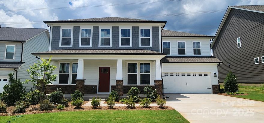 Welcome to Lakeside Glen & our stunning Norris floor plan! THE ONLY QUICK MOVE IN UNDECORATED FIELD MODEL HOME WITH A GUEST SUITE AND PRIVATE ENSUITE ON THE FIRST FLOOR! Spanning 3530 sq ft, this home features 5 bdrms, 4.5 baths, and is brimming with upgrades. The open-concept layout includes LVP flooring in the main level living areas, a gourmet kitchen w/ stainless steel appliances, a 5-burner gas cooktop, wall oven, quartz countertops, and a spacious island perfect for entertaining. The main floor is also home to a formal dining room, a large great rm, & a private office. Ascend the oak-treaded stairs to discover a luxurious primary suite w/ a tray ceiling, dual-sink vanity, tiled shower w/ solid surface seat, and a large walk-in closet. Secondary bdrms are well-sized with walk-in closets & share access to a bonus room, plus a guest bdrm w/ ensuite! A hall bath w/ double vanity and a second-floor laundry rm w/ a sink, add ample storage & convenience. Enjoy the outdoors from the oversized rear covered porch on a private homesite.