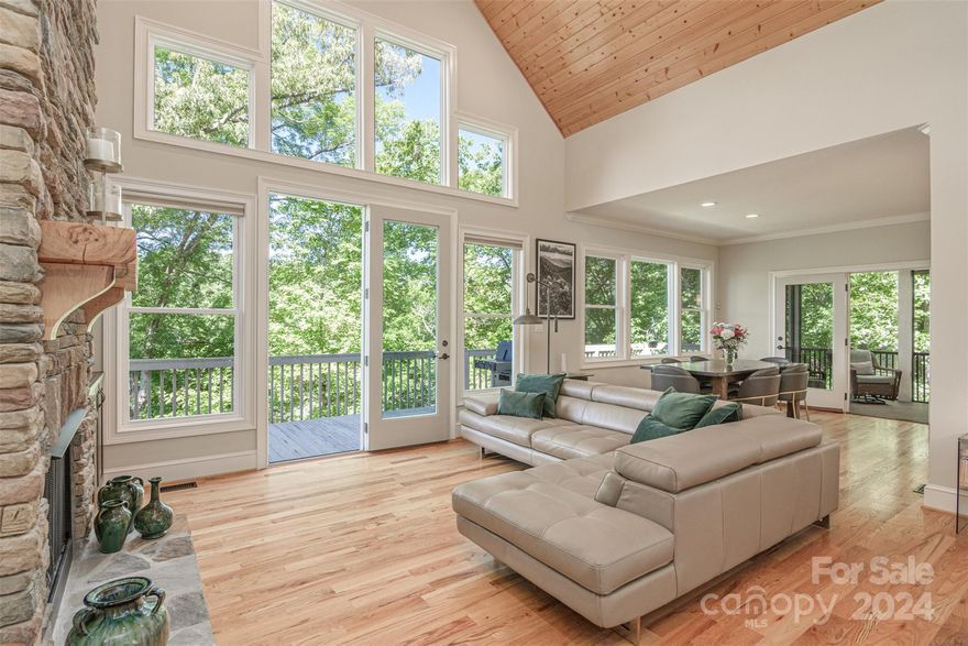 IMMACULATE Custom Built Home on 300 ft of Lakefront. Mountain & Lake Views! Deeded Boat Slip. Highly Sought After Gated Community on a Pristine Mountain Lake. This Striking home Showcases Cathedral Ceilings, 2 Stone Fireplaces, Beautiful Hardwood Floors, Open Floor Plan. Decks for Entertaining. You can See the Mountains Lying in Bed! Main Floor: LG Primary Bdrm has a Stunning En-Suite w/Slate, Tile & Stone Finishes, Custom Cabinets, Soaking Tub, Spacious Walk-in Closets. Granite Countertops throughout. Large Office. Ultra Modern Chef's Kitchen with Induction Range, Convection Oven & Microwave, Back-Lit Custom Cabinets, Large Island w/Seating. Walk-In Pantry. Custom Window Blinds throughout. 3rd Bdrm w/Ensuite above Garage. Downstairs: 2nd Living Rm, Primary Bdrm w/Ensuite in Travertine & Stone. Media Rm & Walk-out to Decks. Hiking-Kayaking-Boating-Fishing-Relaxing. This could be YOUR Life! 12 MIN to Shopping. Fast Hwy access to Columbus, Hendersonville, Tryon, Asheville & Airports.