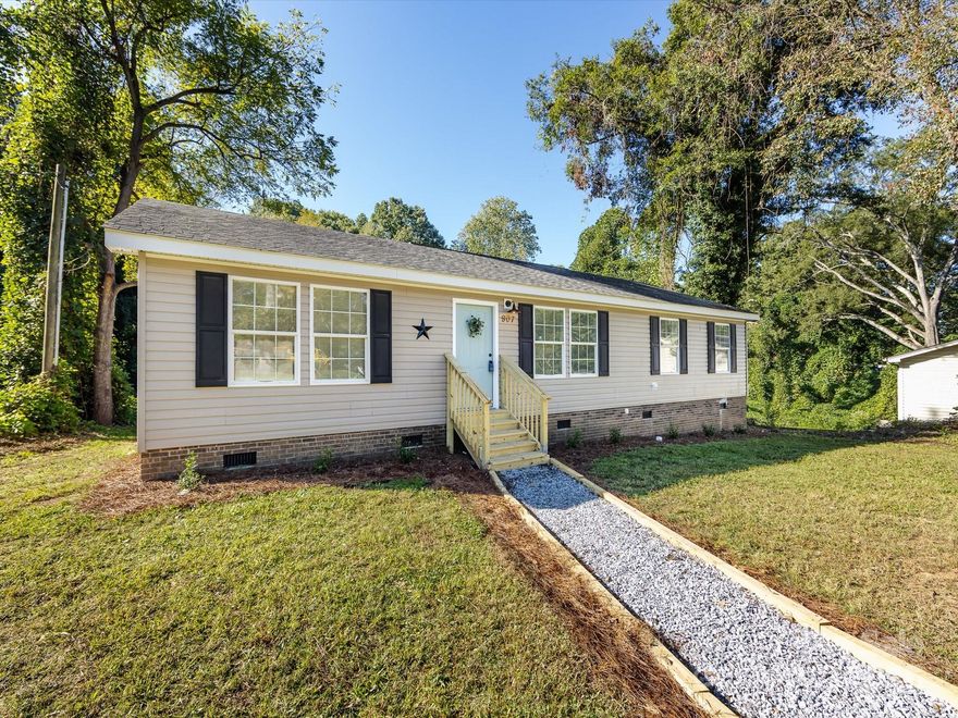 1% Mortgage Rate Buy Down Available! Discover turnkey living just minutes from Downtown Gastonia at 907 E 4th! This updated 4-bedroom, 2-bath home blends modern finishes with everyday comfort and a flexible layout that works for today’s lifestyles. Large 0.42 city lot! Step inside to an inviting, light-filled living area with new LVP flooring & carpet, fresh designer paint, and on-trend lighting. The kitchen shines with all new cabinetry, solid-surface countertops, shiplap backsplash, custom farm shelving, barn doors, custom island and new stainless steel appliances—perfect for weeknight dinners or weekend entertaining. The private bedroom wing features a spacious primary suite with an updated bath and generous walk-in closet space, plus three additional bedrooms that can flex as guest rooms, office, or playroom. Both baths are stylishly updated with contemporary fixtures and finishes. Enjoy easy indoor-outdoor living with a level yard ideal for gatherings, pets, and play—bring your grill and imagination! Thoughtful touches throughout—updated hardware, trim details, board and batten & ship lap accent walls—create a fresh, welcoming feel.  Location matters, and 907 E 4th delivers: convenient to downtown dining and shops, greenways, FUSE district and parks, I-85 for quick commutes, and just a short hop to Charlotte attractions. Everyday essentials, schools, and healthcare are all nearby. With 4 true bedrooms, this home offers the space and flexibility hard to find at this price point in Gastonia. This one will go quickly!