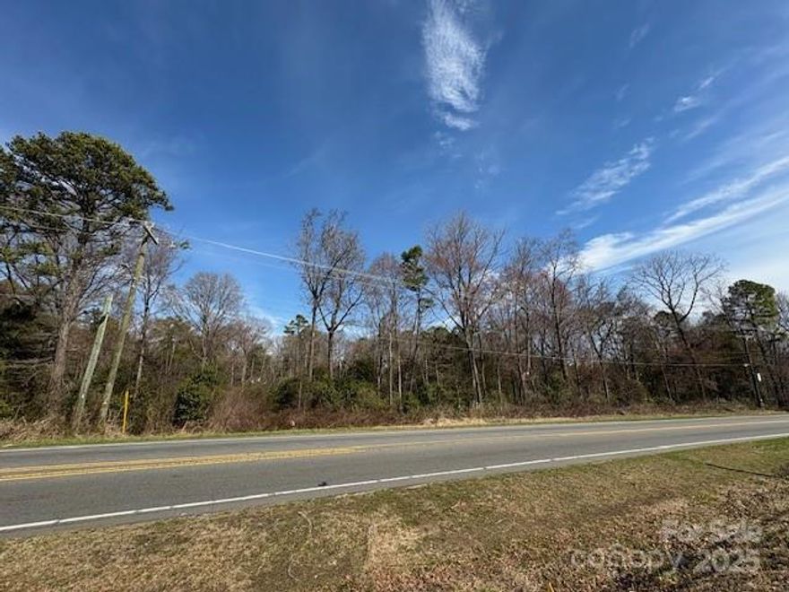 2.38 Acres on Lawyers Road. Mostly wooded, some clearing of newer underbrush would be needed. City water/sewer tap fees and additionally would require extension fee to hook in. Please verify timeframe and costs with city.  Easy access to shopping, schools and variety of major roads. Check survey in attachments for approximate location. Property is on the left from Albemarle Rd, just before reaching Harri Ann Drive