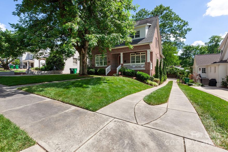 Charming, spacious and on a fantastic street in Myers Park. In one direction, you have the stores & restaurants of Selwyn Ave. In the other, the popular Park Road Shopping Center. Relax on 1 of 2 covered outdoor living areas, the front porch or the back porch which spans the house. Inside, there's a 1st floor bedroom & full bath, and a flex/office w/built-ins. The large kitchen has marble countertops, a bar area, plus an island w/prep sink. It overlooks the dining & great rooms w/fireplace & separate wet bar (great future wine cellar). Upstairs, there are 3 more bedrooms, including the primary suite w/luxurious bath (including a warming drawer for towels), 2 customized closets, one w/wall safe. There's a jack-n-jill bath w/separate vanities, and 2 more bedrooms, one w/a cool bonus/play area. Laundry is on floor 2, along w/a pocket office/storage. Basement has another bar with fridge, a flex space, family room, plus bed/bath and 2-car garage w/car charger. Welcome home!