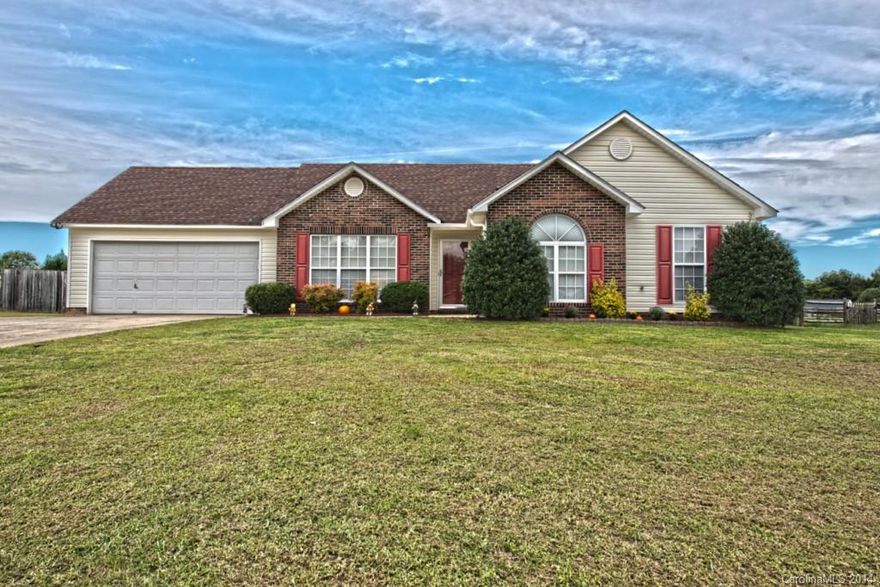 Awesome Ranch with upgrades!  Interior features Vaulted ceilings in living room, Low maintenance laminate flooring in living room and hallway, New carpet in bedrooms, Tray ceiling in master, and New tile flooring and New solid surface counter tops in kitchen.  Exterior features, large, flat, fenced in yard with storage shed.  2 Year old roof.