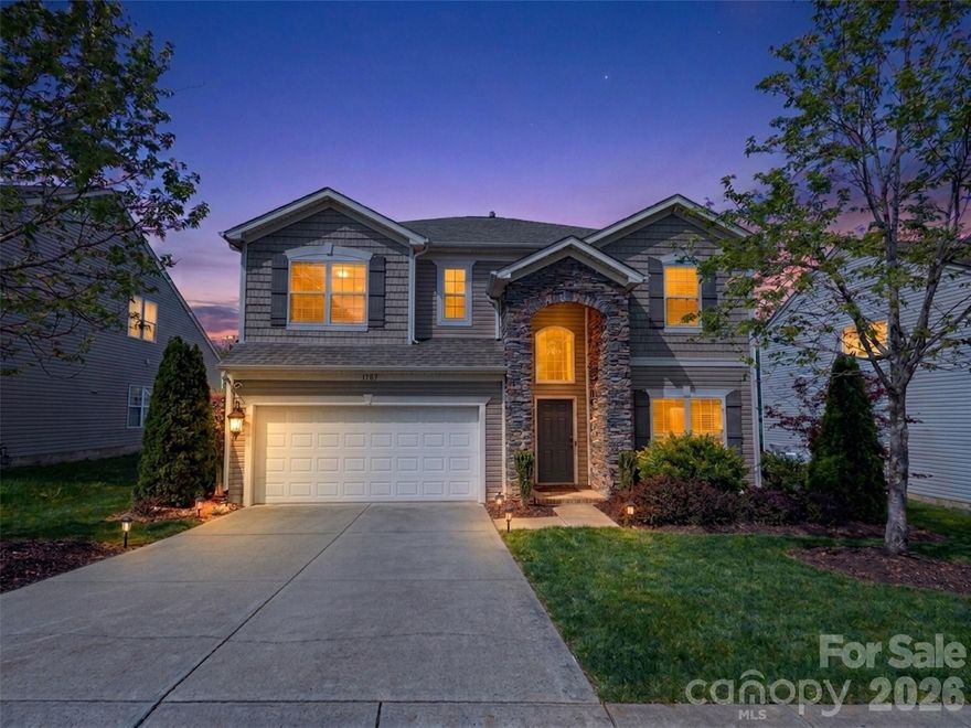 Eligible for 0% down, No PMI, and 10K lender credit! Welcome to 10307 Dominion Village Drive — a stunning 4-bedroom, 2.5-bath home in one of Charlotte's most sought-after communities, Highland Creek. With 2,855 square feet, a 2-car attached garage, and resort-style amenities right outside your door, this is the lifestyle upgrade you've been waiting for. From the moment you arrive, the partial stone front exterior and fresh landscaping set the tone. Step inside to a two-story foyer and an open main level featuring upgraded laminate wood flooring throughout — all freshly painted for a truly move-in ready experience. A dedicated main-level office provides the perfect work-from-home setup. The vaulted living room with ceiling fan flows seamlessly into the kitchen, where you'll find quartz countertops, freshly repainted cabinets, and an island with seating — perfect for gathering. The main-level primary suite is your private escape, complete with vaulted ceilings, a custom wood trim accent wall, and a fully updated en-suite bath boasting luxury tile floors, dual quartz vanity, a tiled walk-in shower, and a soaking tub. Upstairs, three generously sized bedrooms and a large loft overlooking the living room and two-story foyer add flexible living space — ideal for a playroom, 2nd office, or media room. Step outside to your 14x14 covered rear patio with a gas fireplace added in 2022 — your year-round outdoor living room. The fully fenced backyard features mature landscaping that's been thoughtfully improved over the years, creating a private retreat you'll never want to leave. Major mechanicals are already taken care of — roof replaced in 2021, furnace in 2023, and A/C in 2018 — so you can move in with confidence. Highland Creek delivers an amenity-rich lifestyle with four swimming pools, tennis courts, a golf course, fitness center, pocket parks, playgrounds, and miles of walking paths. And the location is unbeatable — minutes to Concord Mills, the Shoppes at Highland Creek, Huntersville, Skybrook Golf Club, and quick access to I-485. This home has it all. Schedule your showing before it's gone.