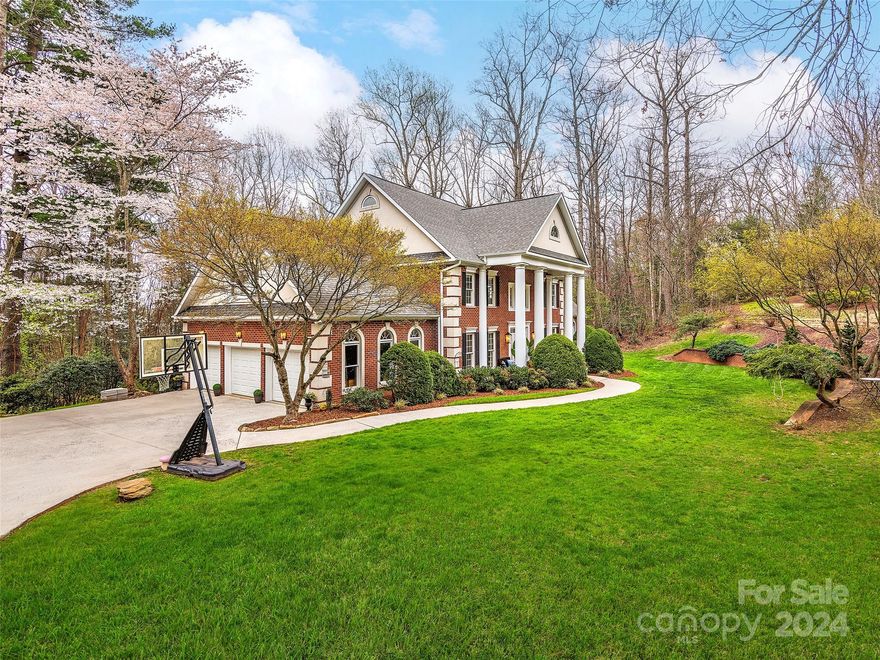 Impressive Biltmore Park home situated on an expansive 1+ acre lot. You will love the casual elegance that permeates the updated interior. Fantastic gourmet kitchen, sunny living room with high ceilings and a wood-burning fireplace. Five spacious bedrooms upstairs, including a sumptuous primary bedroom with spa-like bath and oversized closet. Hardwood floors throughout, custom fixtures, and a neutral color palette. Need more space? The large walk-out basement is the ideal backdrop for work and play. Guests will love the private bedroom and bath, and the second kitchen. The backyard offers an open deck overlooking a level grassy area.