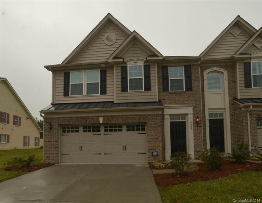 LIKE NEW 3 bedroom, 2.5 bathroom end unit townhome in South Ballantyne off Lancaster Hwy! Modern, dark floors downstairs with granite in the kitchen and baths. The kitchen offers stainless appliances including a freezer-on-bottom refrigerator. Front loading washer & dryer are included! Bathrooms feature oil-rubbed bronze fixtures and the master bathroom has double sinks and a glass door shower. All 3 bedrooms are located upstairs.