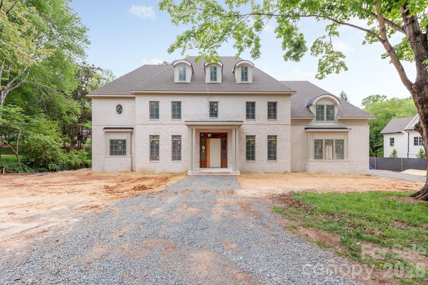 Welcome to 2311 Thornridge Rd. by THR Design Build. Set on 0.60 acres in one of Charlotte’s most desirable areas, this 6,309-square-foot custom home offers 5 bedrooms and 6.5 bathrooms and is one you’ll want to see today.

Starting with the exterior, no detail has been spared. An estate-style brick veneer and professionally landscaped yard create incredible curb appeal. The retreat-like backyard features a 440-square-foot screened porch with a fireplace overlooking a jaw-dropping pool, while still offering plenty of yard space for entertaining and endless possibilities.

Inside, the home showcases everything you would expect from THR Design Build, with custom finishes throughout. Enter through the foyer to find a private office on the left before continuing into the expansive living room, highlighted by three sets of French doors leading to the backyard. The living and dining areas are connected by a stunning two-sided Isokern gas fireplace.

The chef’s kitchen features Thermador appliances with paneled refrigerator and wine fridge. A spacious scullery provides additional storage, plus a secondary sink and dishwasher.

Additional highlights include four upstairs bedrooms, each with direct bathroom access, two bonus rooms, and 10-foot ceilings throughout the main level. Vaulted ceilings elevate the primary suite, upstairs bonus room, and fourth bedroom. Laundry rooms are conveniently located both upstairs and within the primary closet. The home is also Energy Star certified.

With too many upgrades and features to list, schedule your private showing today and meet with the builder to see everything this amazing home has to offer.