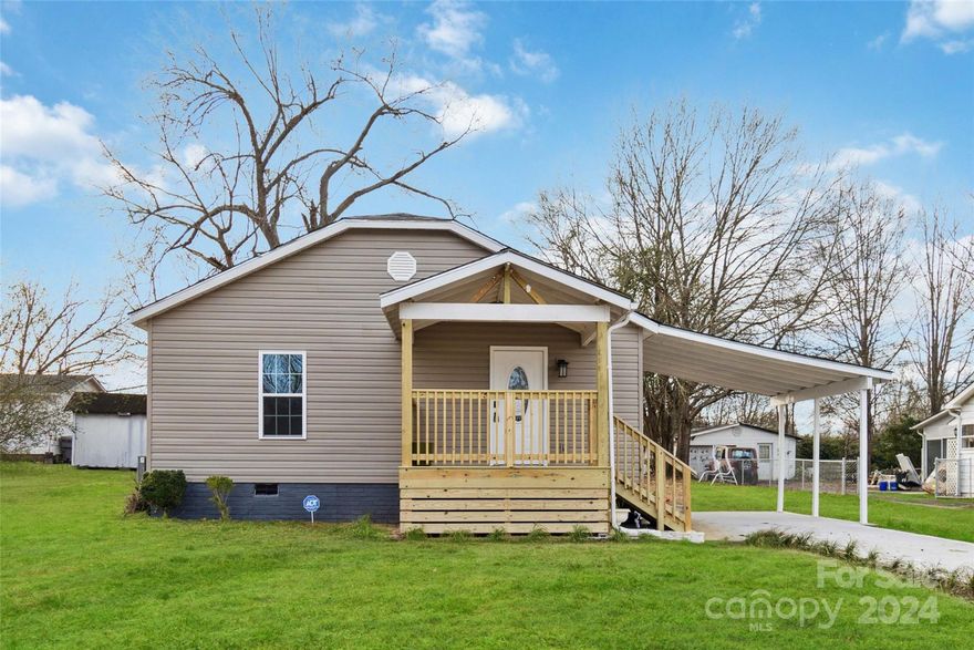 Super Cute Bungalow in downtown Clover.  This home was remodeled around 1981 & remodeled by new owner this year - to include new floorplan, wiring, plumbing, and new roof. Home is situated just minutes from downtown Clover.  All work permitted by City of Clover. Work by licensed general contractor. Home feels like a brand new home with all the updates completed. When you enter you are greeted by the spacious living area and open kitchen which features quartz countertops and stainless steel appliances. Updated cabinets, fixtures, Luxury Vinyl Plank flooring, and updated double insulated windows.  Renovated bathrooms feature updated cabinets, fixtures and decorator tile.  Enjoy your morning coffee on your covered front porch or plan those weekend barbecues on the back deck.  There is storage  in the backyard shed.  This home is situated on a flat lot.  Home includes a one year home warranty and an installed security system.  You surely won't want to miss this one ... it won't last long!