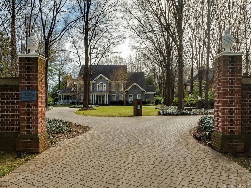 Spectacular home on a 1.49 acre lot combines luxury & privacy. Tucked behind brick wall, it all begins with the distinctive driveway, gas lanterns and welcoming porches. This 5 bedroom home has great flow and light and features a spacious, gourmet kitchen and a main-level, luxurious master suite. Perfect for entertaining with formal & informal dining areas, den and bonus rooms. French doors lead to a saltwater pool, stone fireplace, deep backyard with pergolas, paths & gardens.