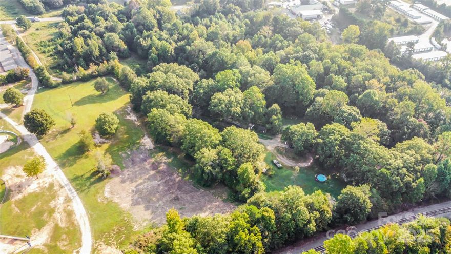 Over 4 acres of partially wooded land off Hwy 27 East in desirable Iron Station, NC, offering endless potential for investors, developers, or homeowners. Property includes two mobile homes, each with its own septic system, plus a county water tap already in place. Located in a top-rated school district and just minutes from Lincolnton and the Charlotte metro, this versatile property is ideal for income-producing rentals, future development, or building your dream home. Don’t miss this rare opportunity to own acreage with existing infrastructure and room to expand.