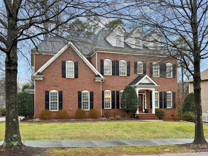 This exceptional 6-bedroom, 4.5-bathroom luxury brick home, spanning over 4100 square feet across 2 stories.  Enter through the welcoming front door to discover a harmonious blend of luxury and functionality. Throughout the main level, hardwood floors create an inviting atmosphere, with the exception of the private ensuite, which features its own private full bath, Open layout with updated kitchen with an island, large pantry, dry bar area, breakfast nook, formal living, formal dining, french doors closes off the office, great room and welcoming entry. All season patio with Eze-Breeze windows for additional relaxation or step onto your patio for entertaining. Primary bedroom has tray ceiling, updated primary bath, oversized glass enclosed shower, elegant bathtub, huge closet. All rooms are spacious.  9-foot ceiling on both floors, laundry room upstairs, bonus room has a closet and can be used as an additional bedroom, the 3rd floor has an additional 806 feet of future living space.