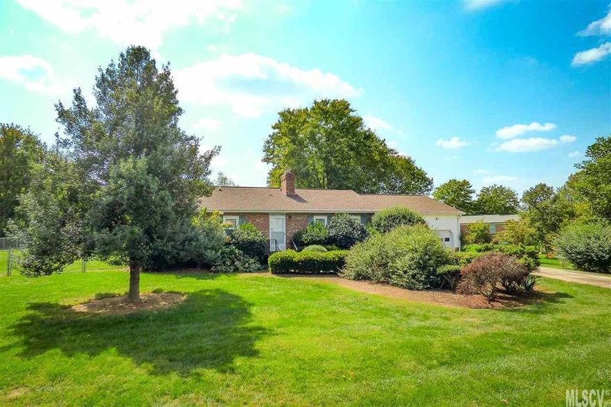 One level home with 2.5 acres near Downtown Maiden! Enjoy beautiful landscaping, fenced backyard, garden area, and 1900 HSF home. Built in 1979, the vintage one-level home offers a formal living room with gas log fireplace, dining room, eat-in kitchen, and a sunny addition with den and exit to the backyard. A central hallway leads to a hall bath and three bedrooms, including a master suite with private bathroom. Single garage with storage. Roof appears to be recently redone, but no records to prove age. Located outside city limits. No City Taxes! Lot lines to be redrawn before closing. Additional adjacent 20 acres available for $140,000, MLS 9596870.