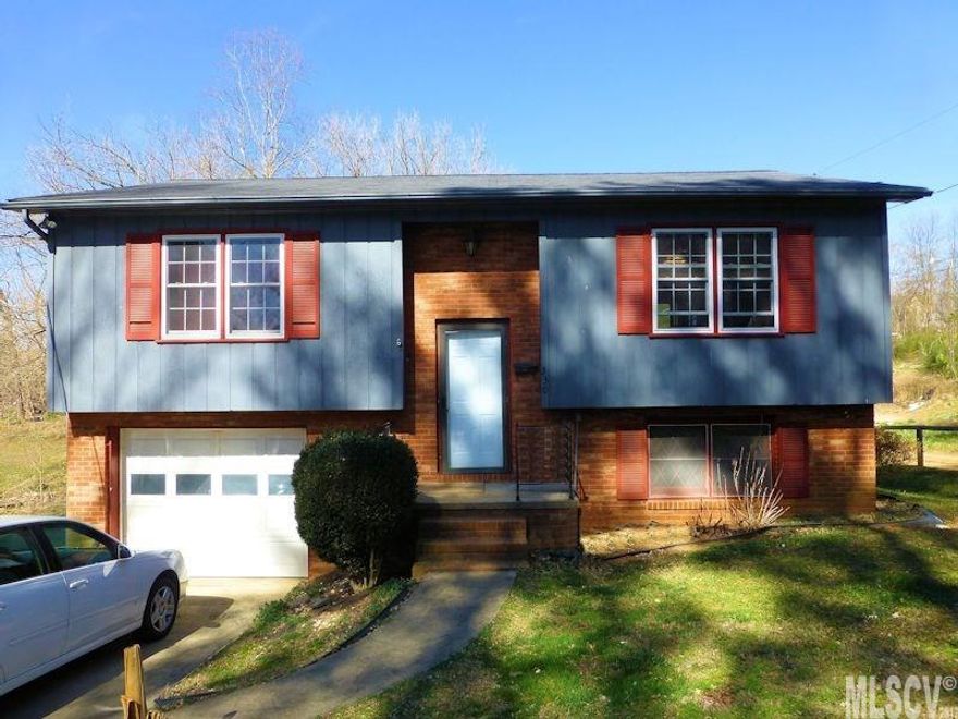 Nice split foyer home....not far from downtown Lenoir. Updated recently with tile flooring in the kitchen and bath(on main level) and tiled countertops in the kitchen. Hardwood floors in the living room and hallway. Living room is open to the kitchen which offers space for a breakfast table area and access to the deck. 2 bedrooms and 1 full bath on the main level. The lower level has a single garage (laundry hookups in the garage) plus a partially finished den, half bath, and the 3rd bedroom. Sellers will leave the TV which is hanging on the wall. City water, sewer, and trash through the City of Lenoir. 0.11 acre lot. Sellers have never lived in this home. CALL TODAY!